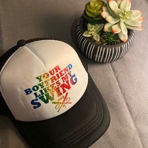 Novelty men’s hat “Your boyfriend likes my swing” pride colors.